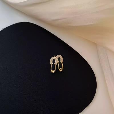 Mini gold safety pin earrings